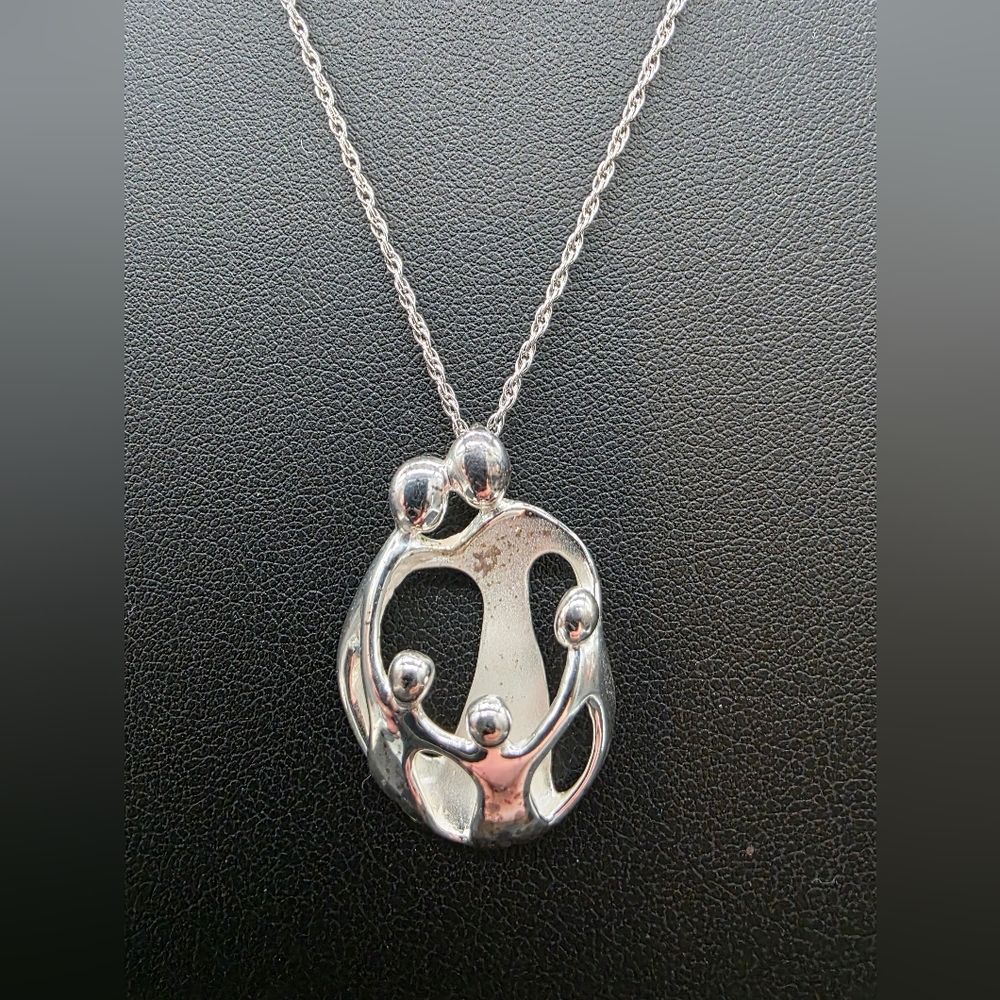 Vintage CAROLYN POLLACK 925 sterling silver "Loving Family" pendant